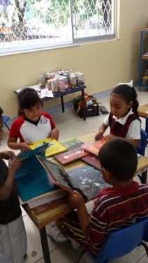 Students looking at their new books.
